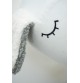 Peluche mouton en crochet MINI signée Crochetts, gros plan sur un oeil
