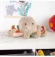 Doudou pieuvre Patchwork Sweety signé Sigikid posé sur une table