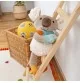 Doudou koala Patchwork Sweety signé Sigikid, sur une échelle